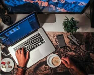 Typing on laptop at NoSweatWeb, a local web design and web development company in Nashville, TN; Franklin, TN and Brentwood, TN.