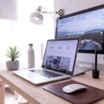 two computer screens showing professionally designed and affordable websites with search optimization, by NoSweatWeb, Nashville's most affordable web design agency with SEO services, and web hosting.