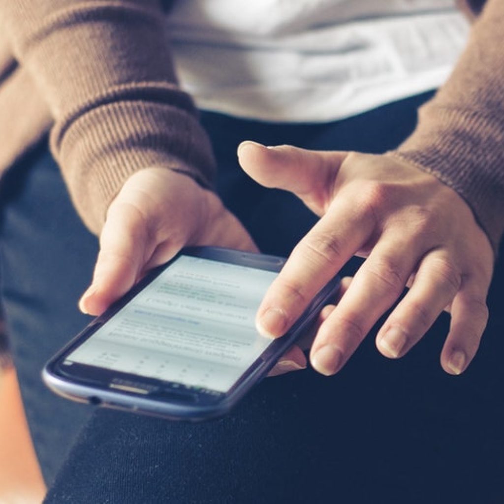 A Nashville customer on cell phone interacting with a responsive website and e-commerce site allowing them to place an order.