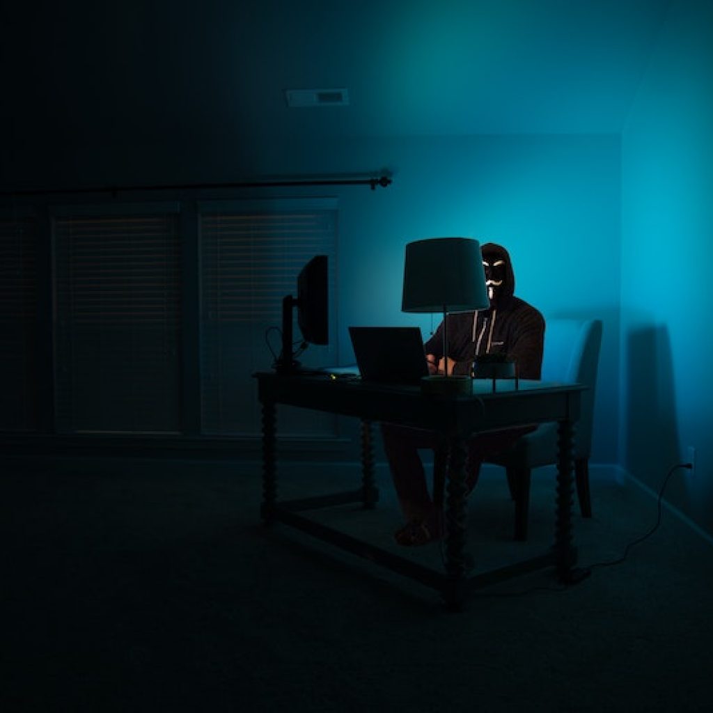 hacker sitting at a computer