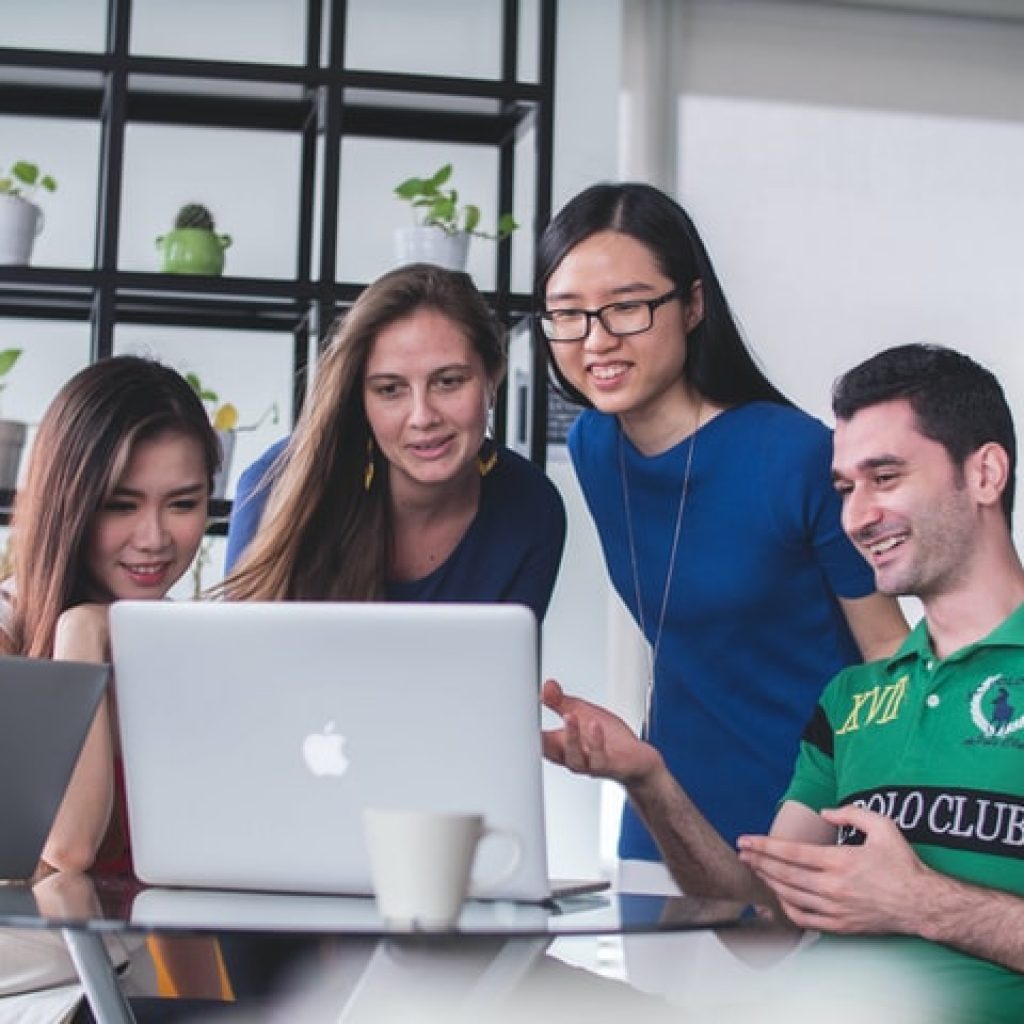Workers looking at computer for Inbound Marketing Results